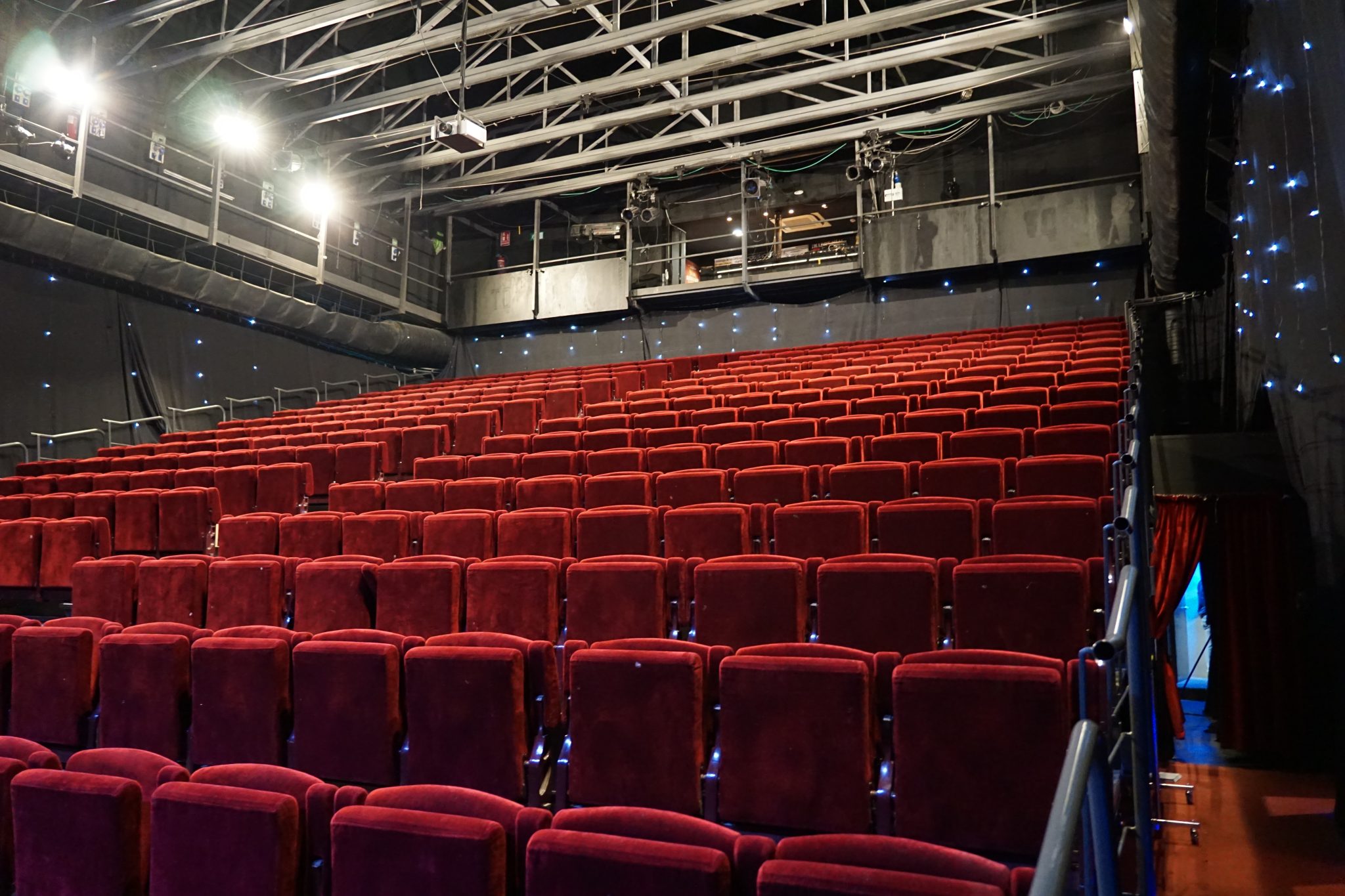 Dark cinema auditorium with rows of seats