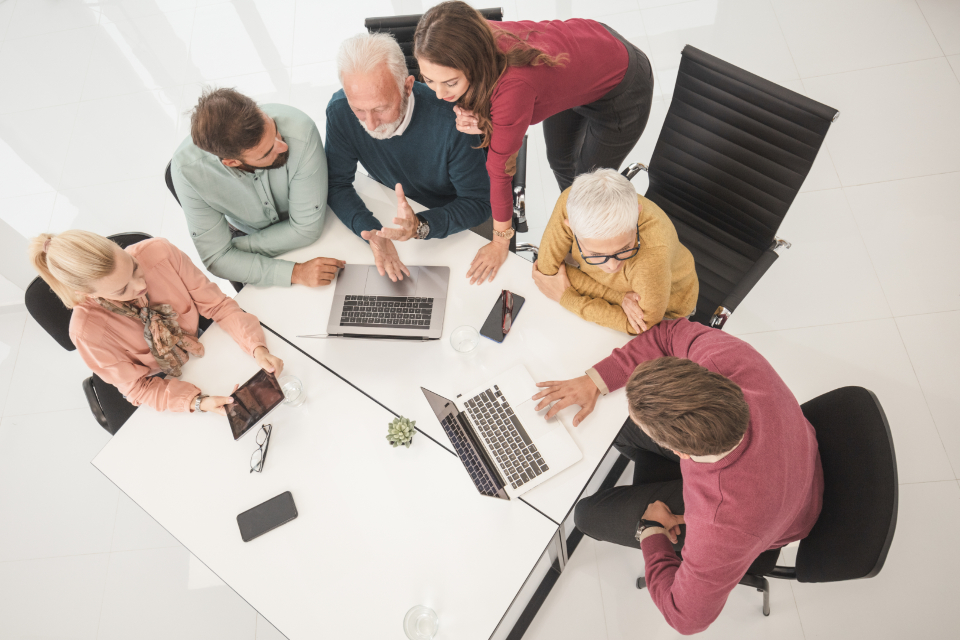 Diverse team collaborating around one table