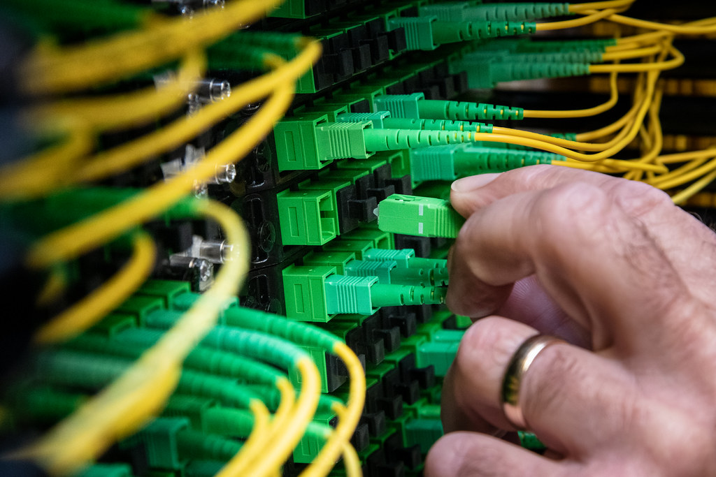 Electrician installing cable conduit