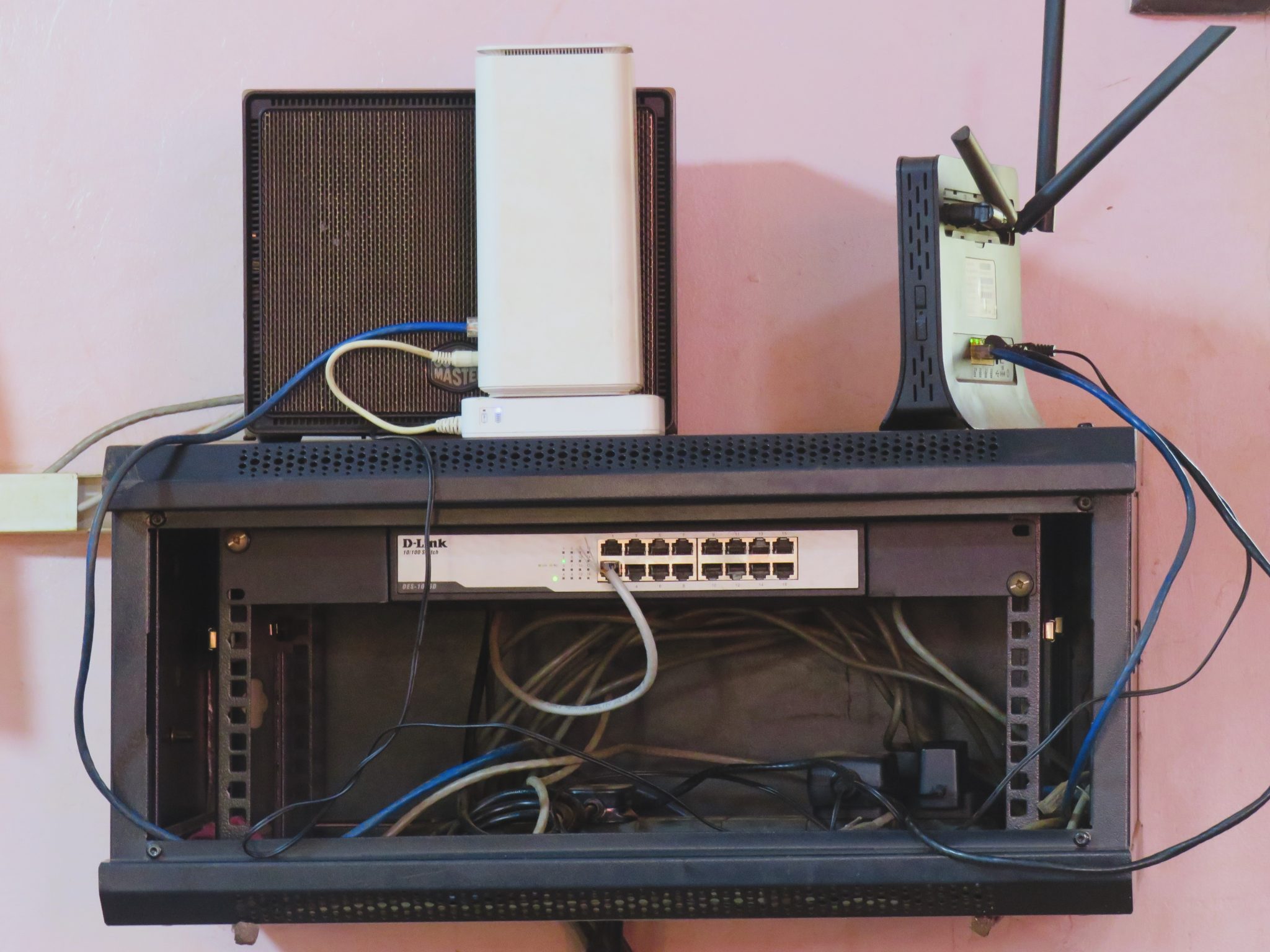 Wall-mounted network rack with switch and router