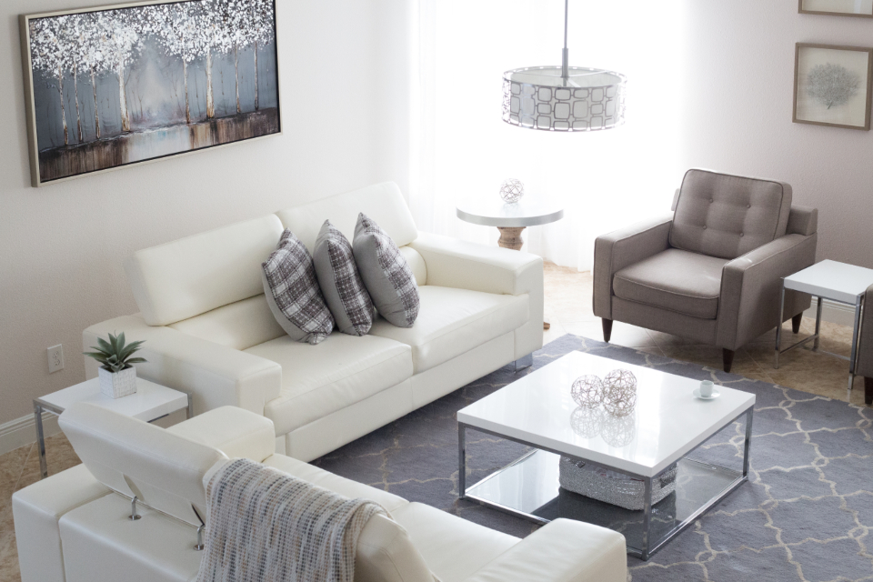 Modern living room with white sofas and coffee table