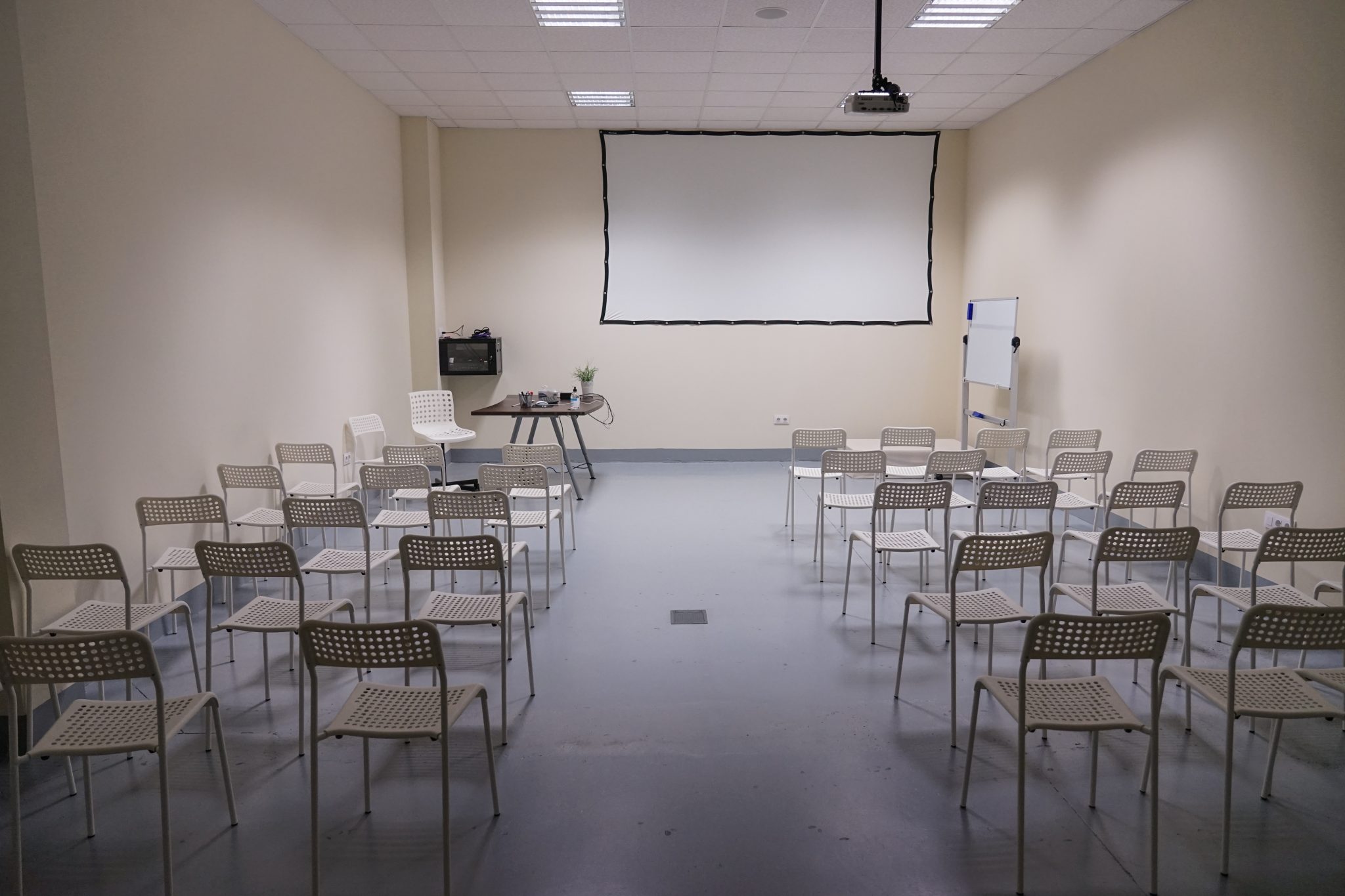 Small conference room with projector screen