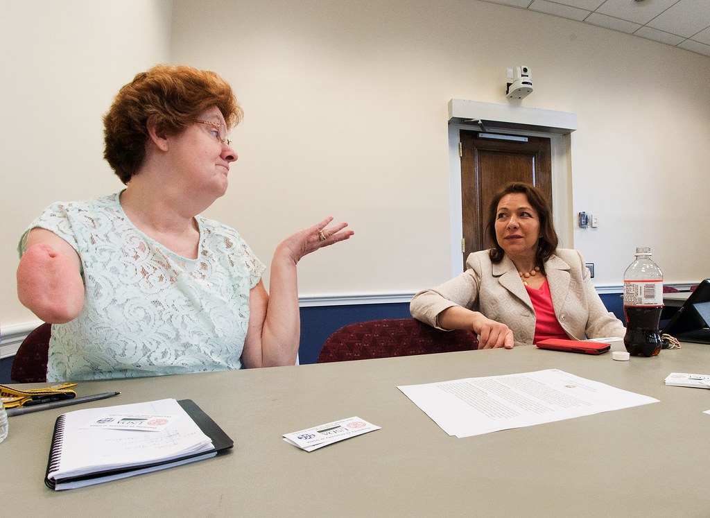 Two colleagues reviewing documents in a working session