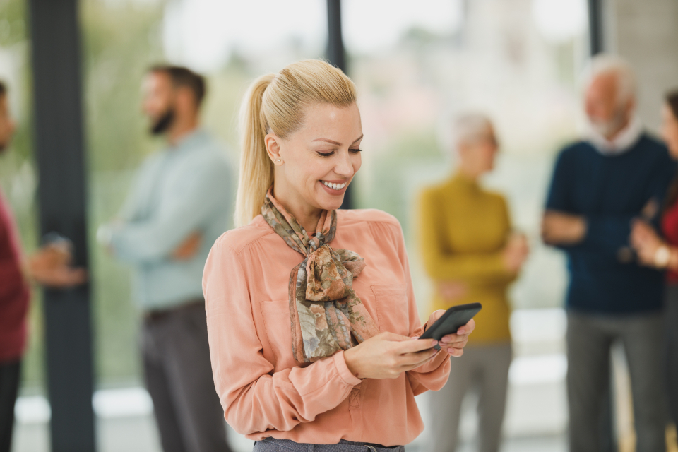 Customer smiling at a smartphone message