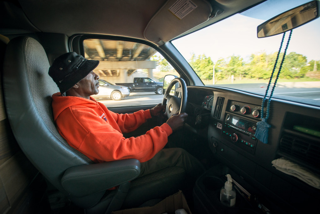 Delivery driver in a truck cab on the road