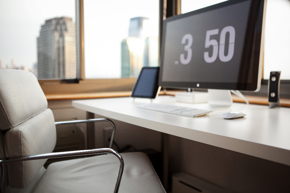 Workstation with a monitor by an office window