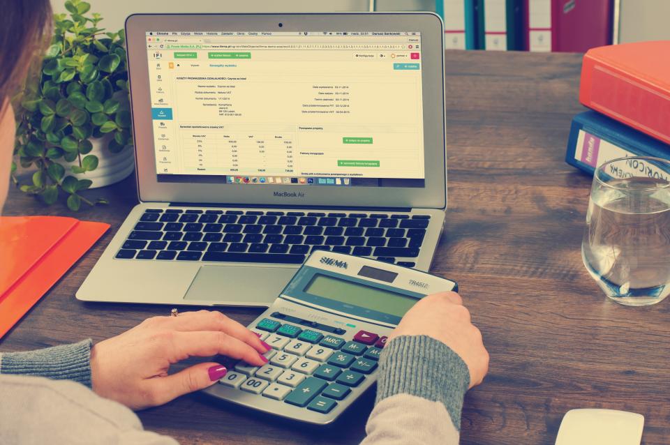 Calculator and finance charts on a desk