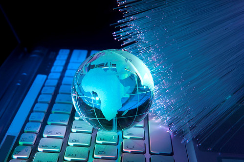 Globe over a fiber-optic network background