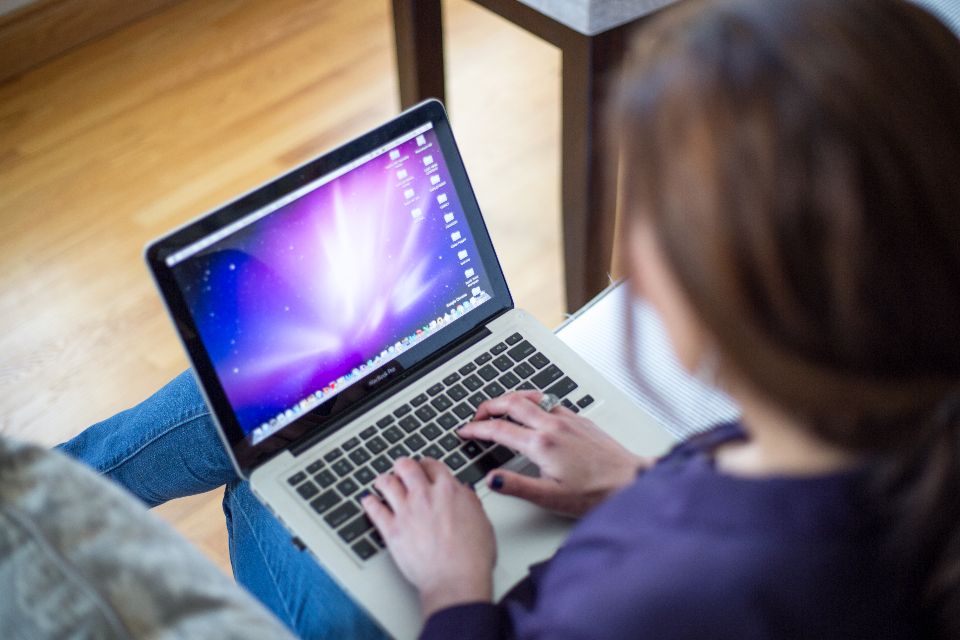 Person typing on a laptop