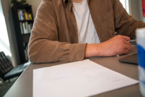 Reviewing paperwork and invoices at a desk