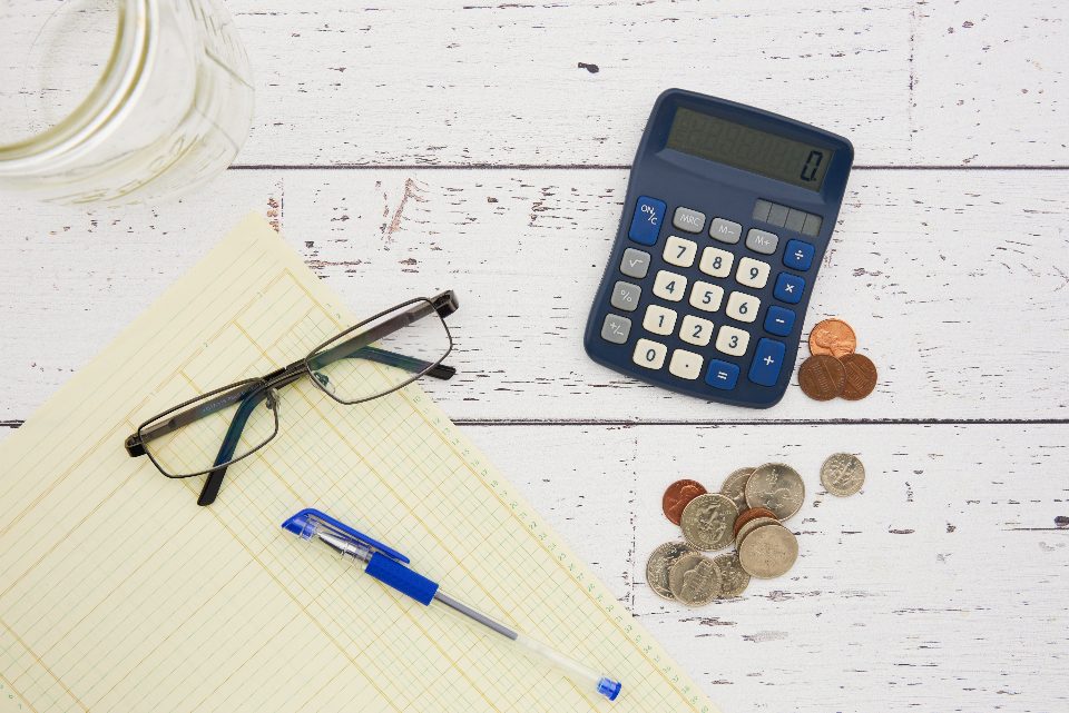 Calculator and finance notes on a desk