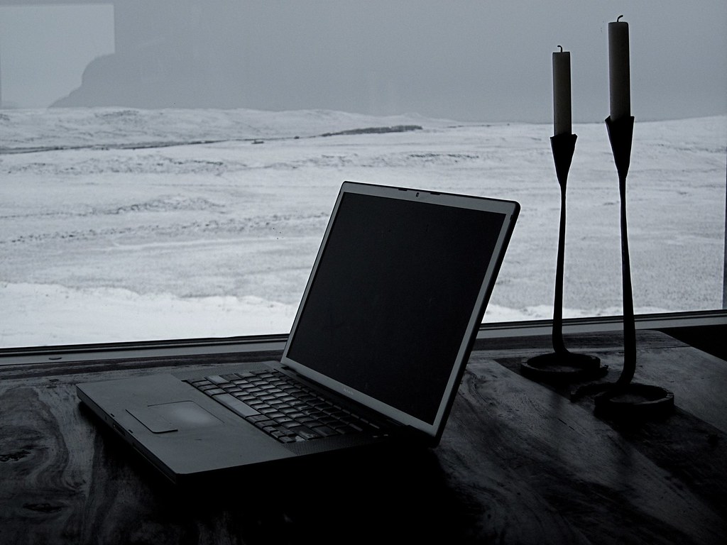 Person working on a laptop in a modern office