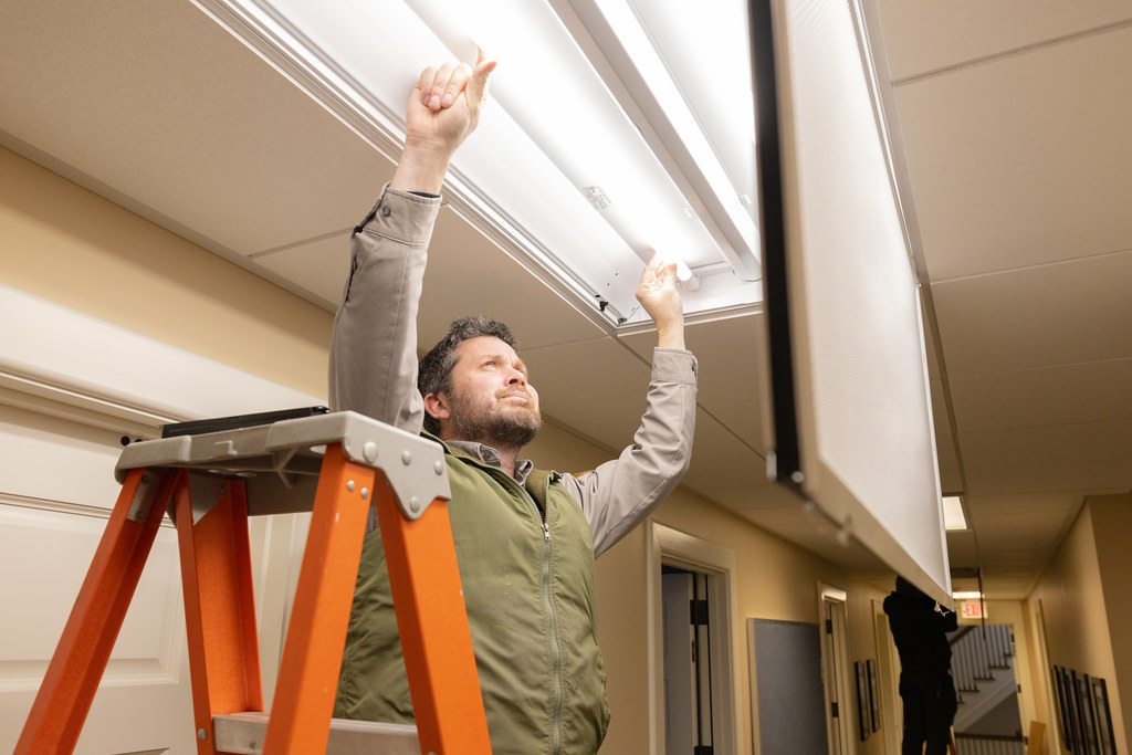 Technician installing low-voltage wiring