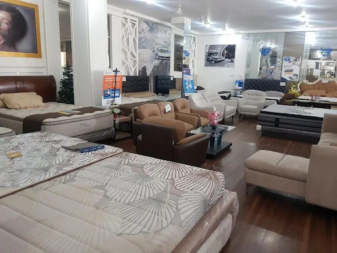 Bright modern furniture showroom with sofas