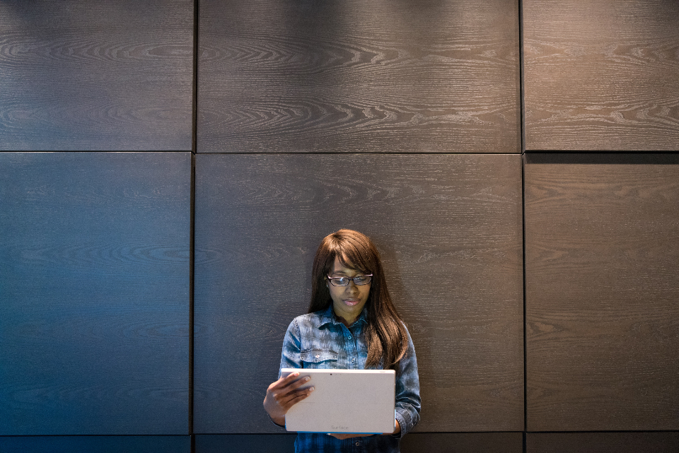 Person at a desk using a tablet