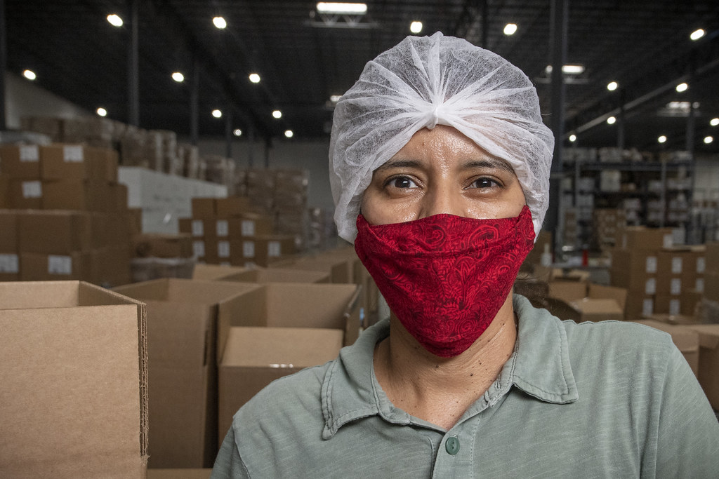 Warehouse workers handling distribution boxes