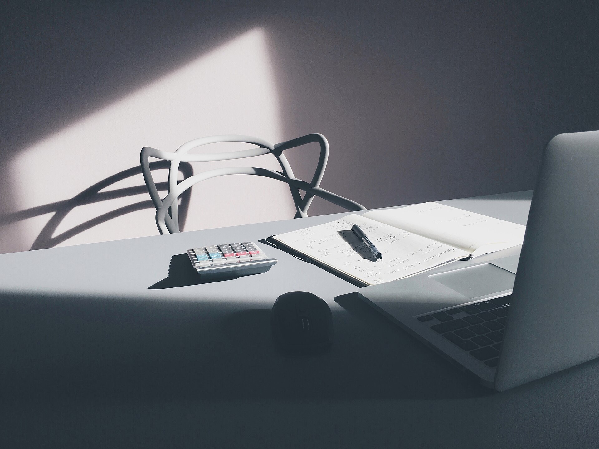 Desktop with a laptop and calculator