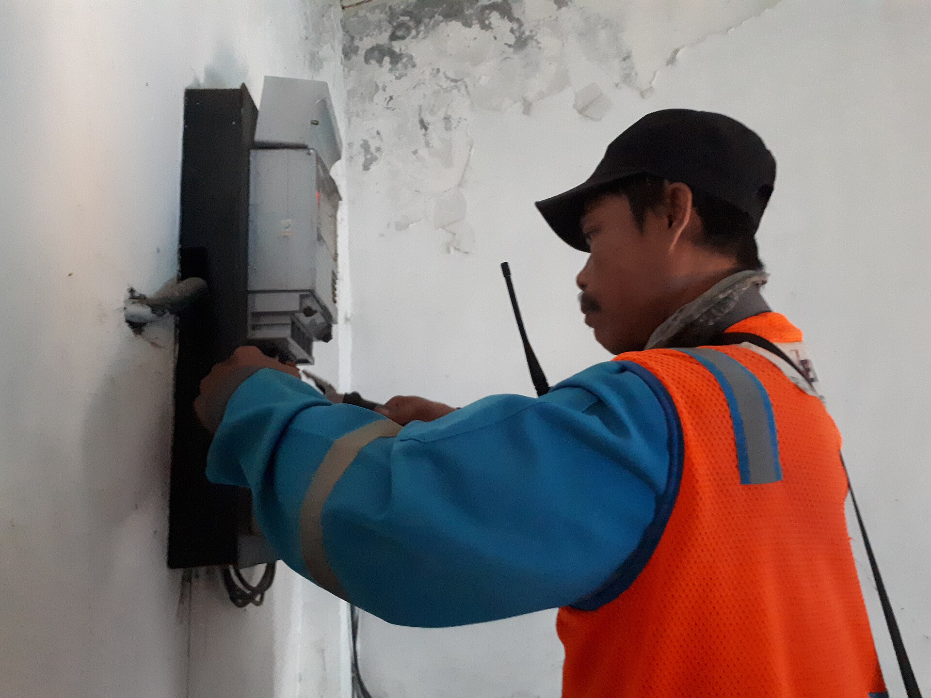 Electricians fixing electricity meter 5