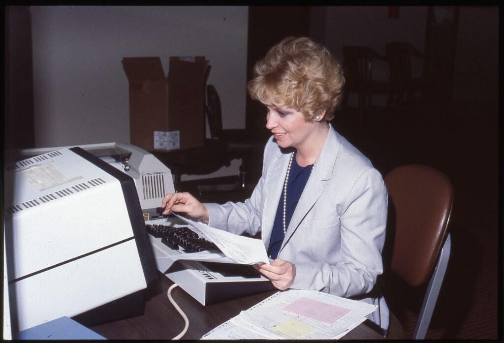 Unidentified female office worker using a computer keyboard - DPLA - 880d2d5a8469b57c338100a4be92ca5c