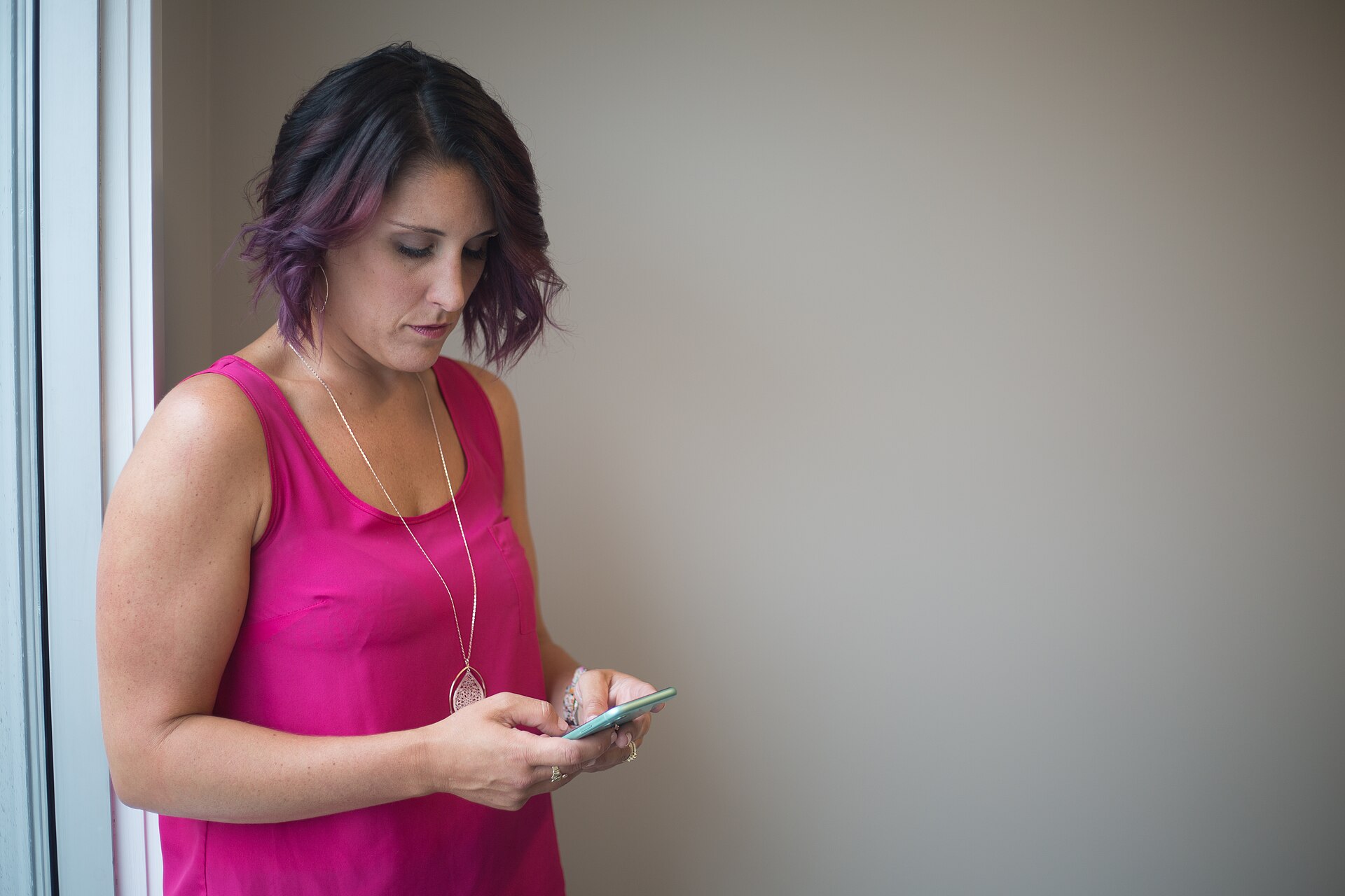 Woman texting on a smartphone