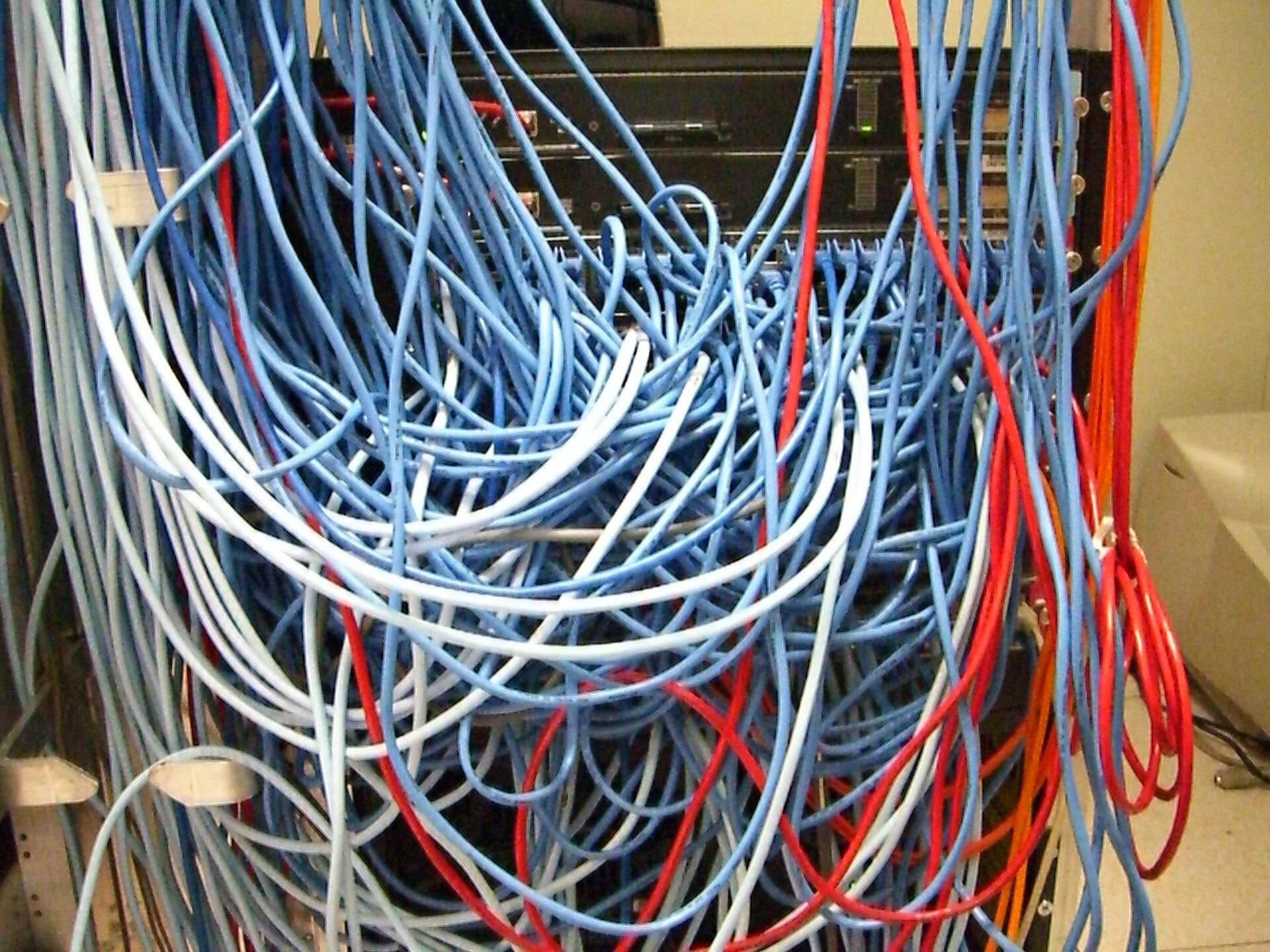 Server Rack with Spaghetti-Like Mass of Network Cables