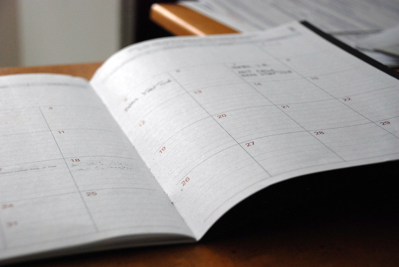 Printed project reports on a white desk