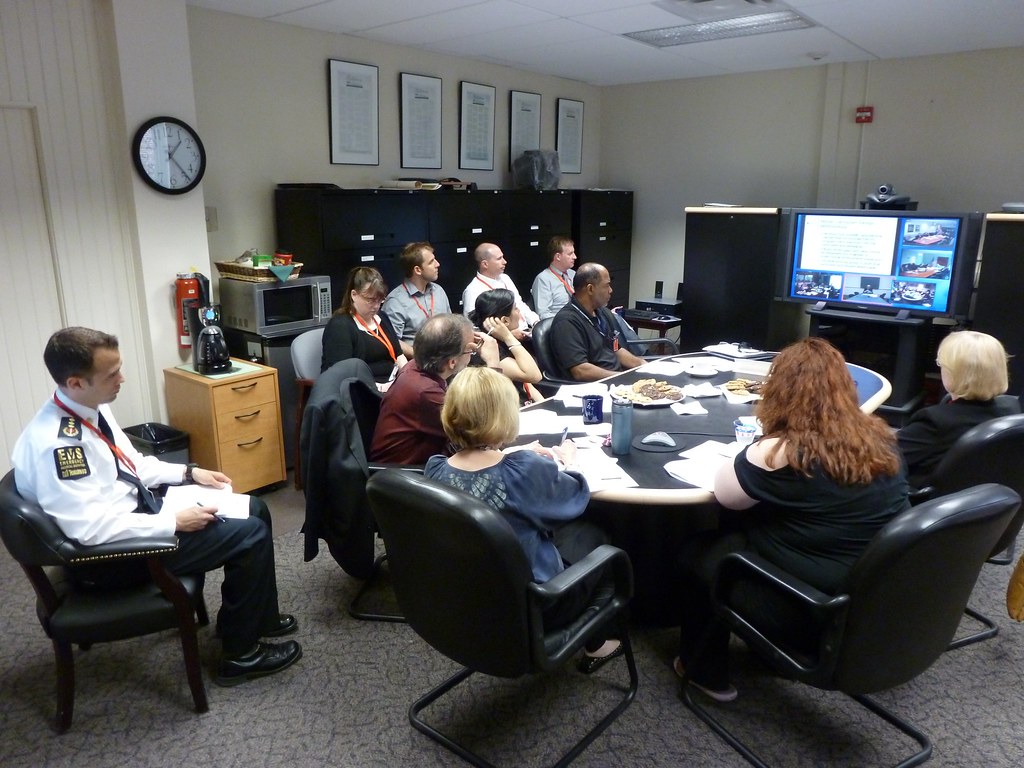 Committee members in discussion around a conference table