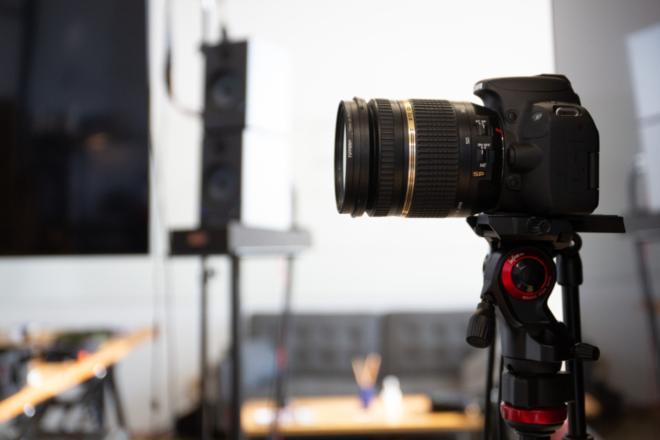 DSLR camera on a tripod in a photography studio