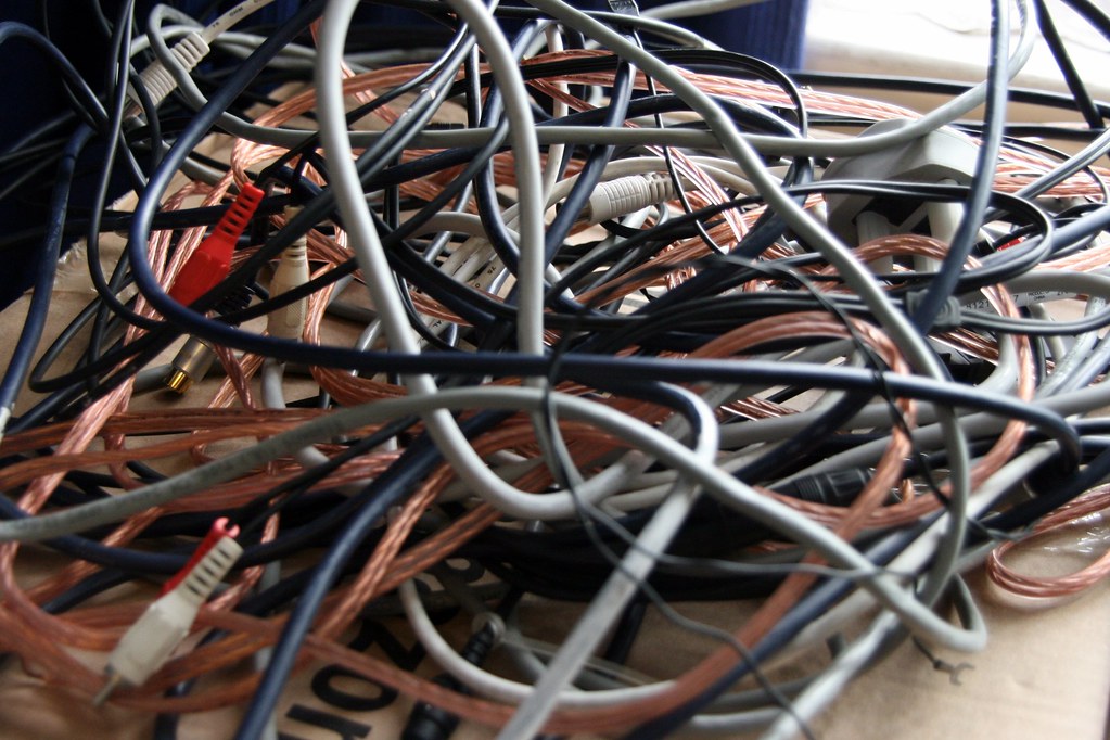 A chaotic pile of tangled network cables
